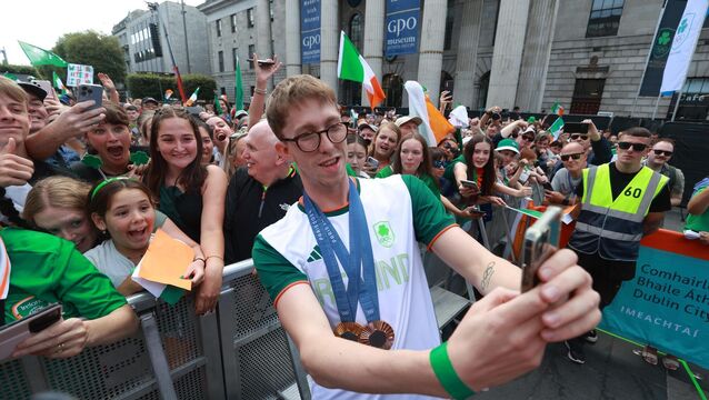<p>Ireland's Daniel Wiffen takes a selfie with fans on O'Connell Street in Dublin during a homecoming event for Irish Olympic athletes returning from the Paris 2024 Olympic Games. Picture: PA</p>