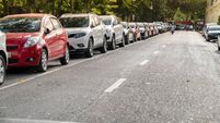 Parallel parking cars on urban street. Outdoor parking on road