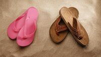 men and women sandals on the beach