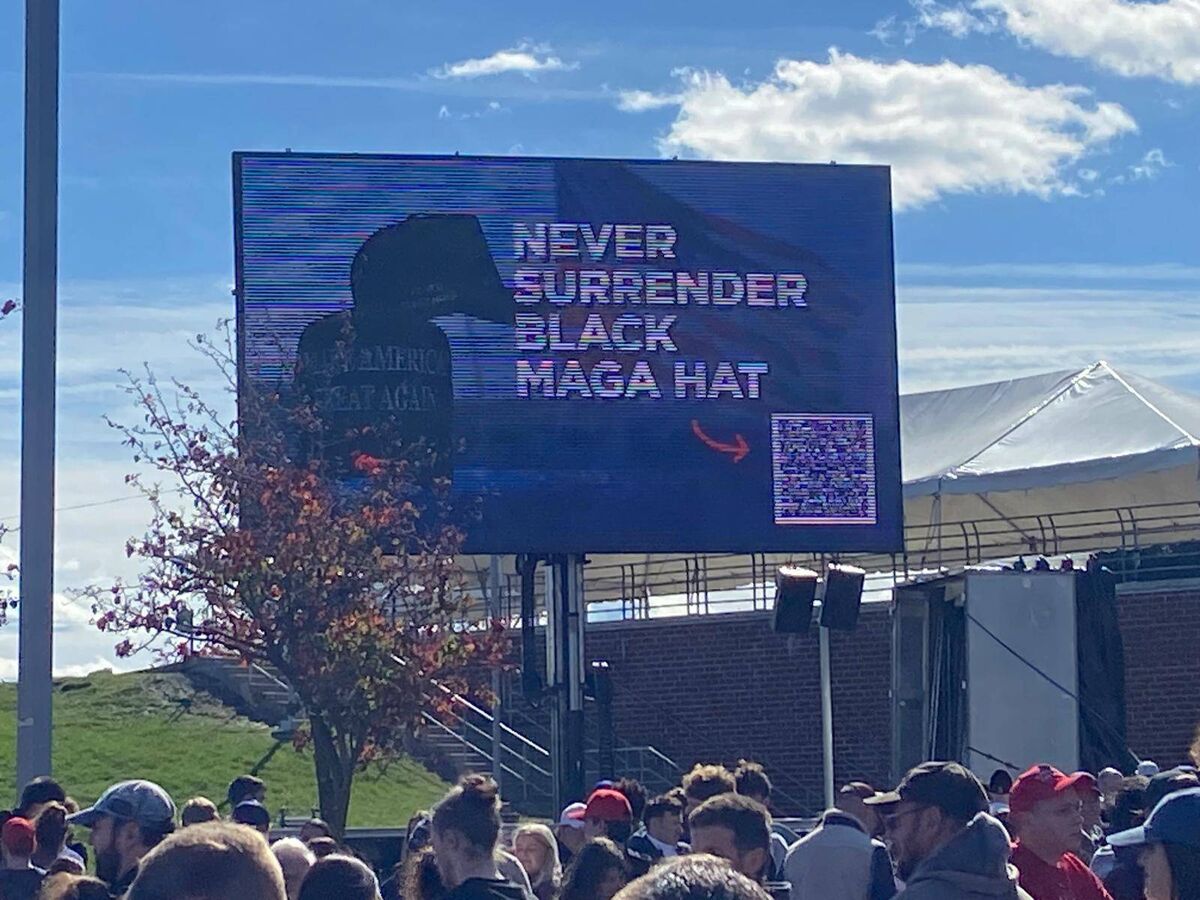 People queuing outside Donald Trump’s rally in Pennsylvania were greeted with posters for Maga hats and other pro-Trump products. People queuing outside Donald Trump’s rally in Pennsylvania were greeted with posters for Maga hats and other pro-Trump products.