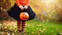 Little girl having fun on Halloween trick or treat