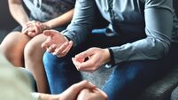 Couple counseling or therapy session. Man talking about problems in the family. Husband and wife meeting their psychiatrist.