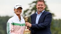 Annabel Dimmock is presented with the KPMG Women's Irish Open trophy by Seamus Hand 1/9/2024