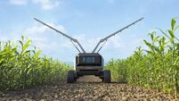 Agricultural robots work in smart farms, Robot spraying fertilizer on corn fields, Smart agriculture farming concept.