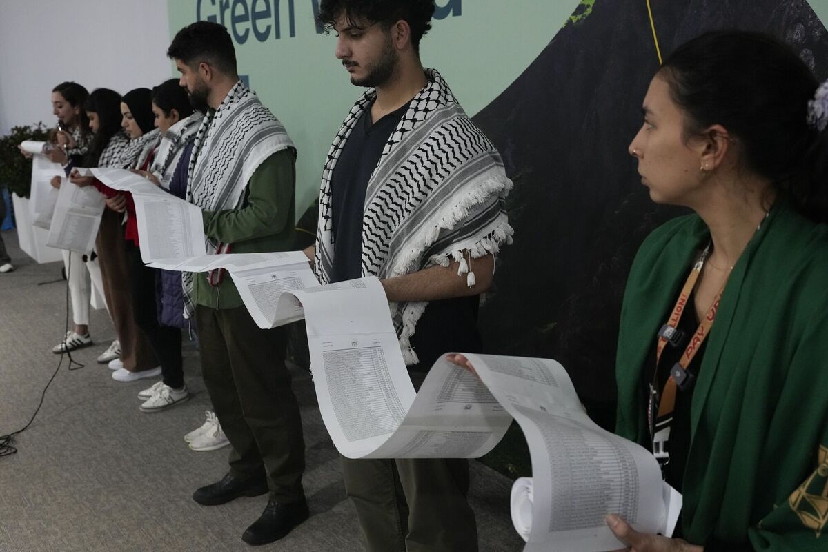 Activists at a Gaza peace demonstration during the Cop29 UN Climate Summit on Monday. The list of children killed in the conflict to date was so long that it required seven people to hold up the huge roll of paper. Photo: AP/Rafiq Maqbool Activists at a Gaza peace demonstration during the Cop29 UN Climate Summit on Monday. The list of children killed in the conflict to date was so long that it required seven people to hold up the huge roll of paper. Photo: AP/Rafiq Maqbool