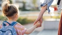 Unrecognizable Daughter Being Taken To School By Her Mother