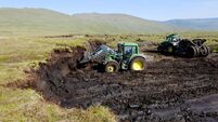 Large scale peat excavation with machinery from a bog in County Tipperary which can be used for garden centre fertiliser Ireland