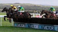 Fact To File, ridden by Mark Walsh, jumps the final fence before winning the John Durkan Memorial Punchestown Steeplechase 24/11