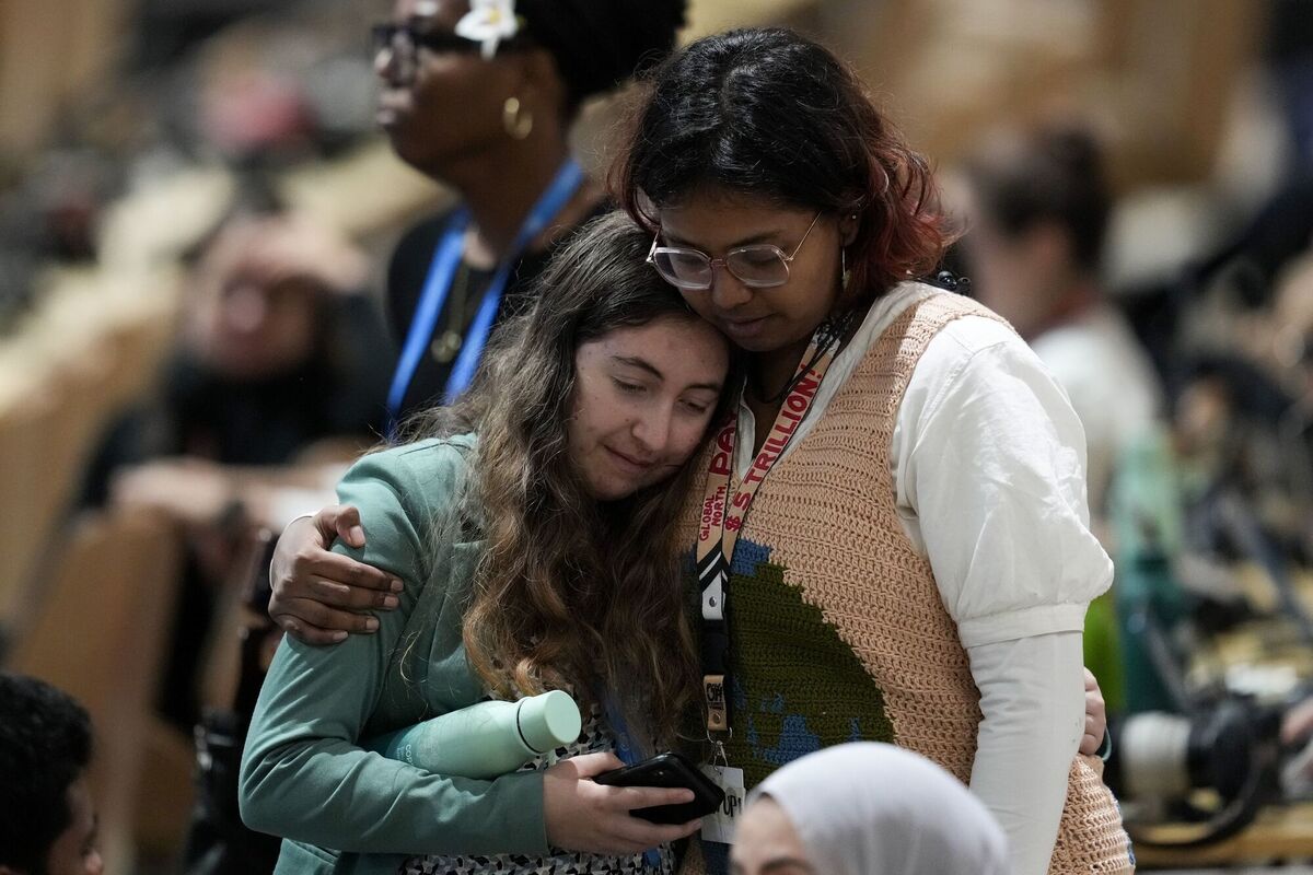 Attendees embrace while attending a closing plenary session at the COP29 U.N. Climate Summit, Sunday, Nov. 24, 2024, in Baku, Azerbaijan. (AP Photo/Rafiq Maqbool) Attendees embrace while attending a closing plenary session at the COP29 U.N. Climate Summit, Sunday, Nov. 24, 2024, in Baku, Azerbaijan. (AP Photo/Rafiq Maqbool)