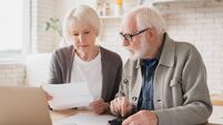 Serious caucasian old elderly senior couple grandparents family counting funds on calculator, doing paperwork, savings, paying d