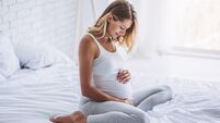 Pregnant in bed.