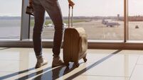 Serene young man watching plane before departure
