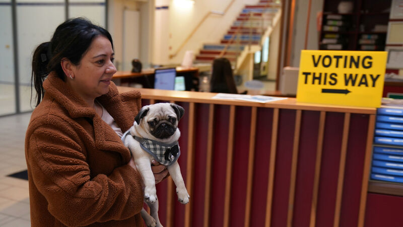 In Pictures: Voters and a pug cast their ballots in the General Election
