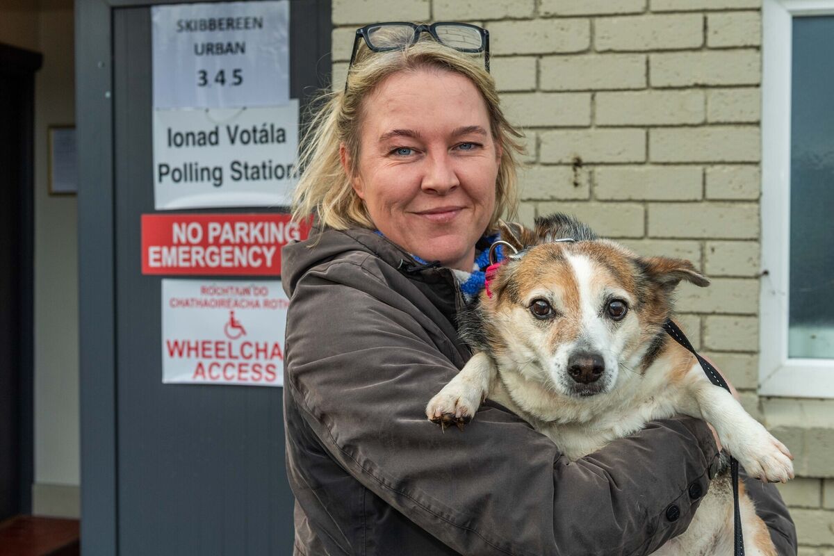 Claire McGonigle of Skibbereen with her rescue dog 'Bailey' after voting this afternoon at O'Donovan Rossa GAA Club, Skibbereen. Picture: Andy Gibson. Claire McGonigle of Skibbereen with her rescue dog 'Bailey' after voting this afternoon at O'Donovan Rossa GAA Club, Skibbereen. Picture: Andy Gibson.