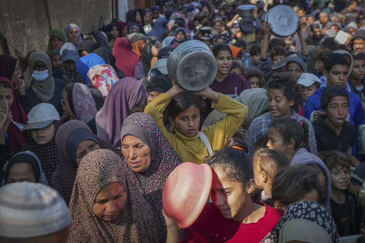 Palestinian children queue at a food distribution kitchen in Deir al-Balah in the Gaza Strip last week. Picture: Abdel Kareem Hana/AP Palestinian children queue at a food distribution kitchen in Deir al-Balah in the Gaza Strip last week. Picture: Abdel Kareem Hana/AP