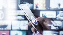 Watching movies and series with smartphone. On demand (VOD) service. Future multimedia technology in mobile phone. Man pressing