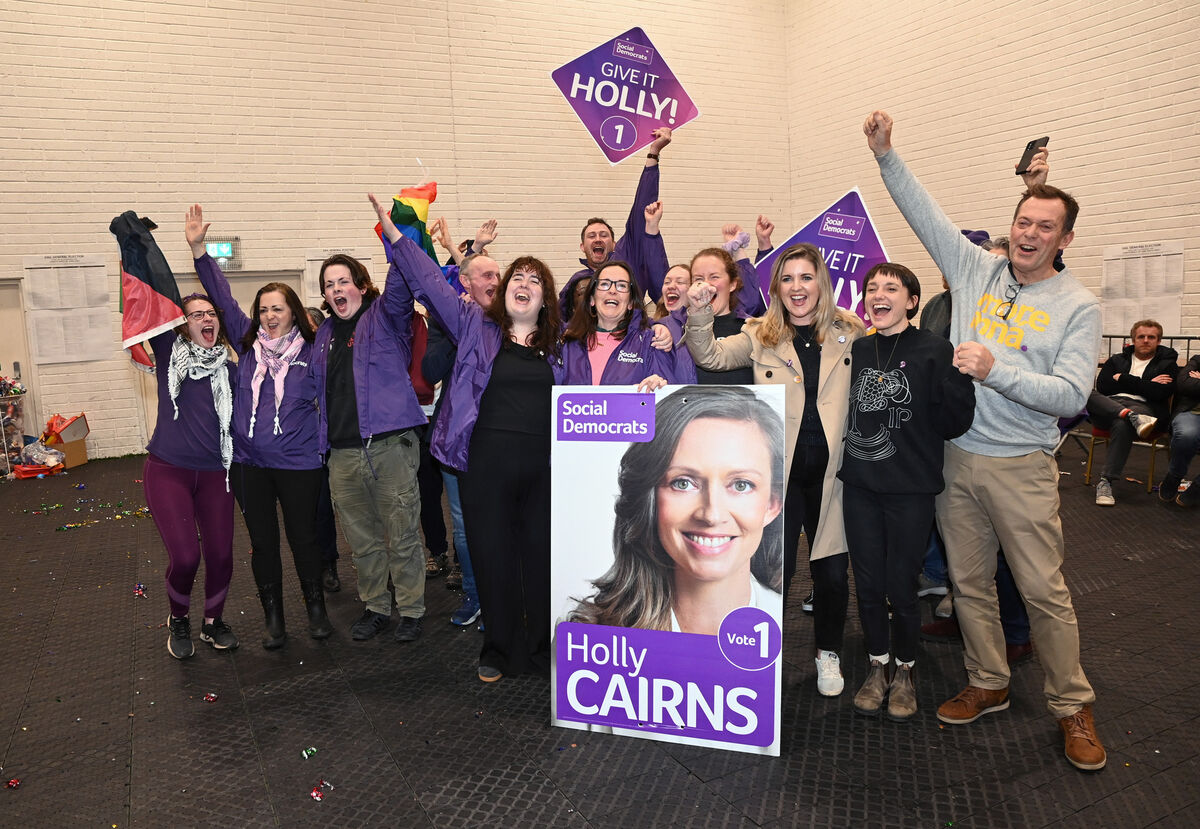 Holly Cairns supporters celebrate her election to Dáil. Ms Cairns was absent from the count centre after giving birth to a baby on polling day. Picture: Eddie O'Hare Holly Cairns supporters celebrate her election to Dáil. Ms Cairns was absent from the count centre after giving birth to a baby on polling day. Picture: Eddie O'Hare