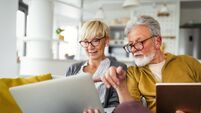 Happy romantic senior couple hugging and enjoying retirement at home