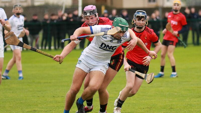 St Flannan's James Hegarty fends off Hospital's Aidan Carroll. Pic: Brendan Gleeson St Flannan's James Hegarty fends off Hospital's Aidan Carroll. Pic: Brendan Gleeson